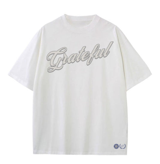 White t-shirt with 'Grateful' text on a white background
